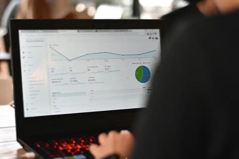 Person on laptop viewing website analytics