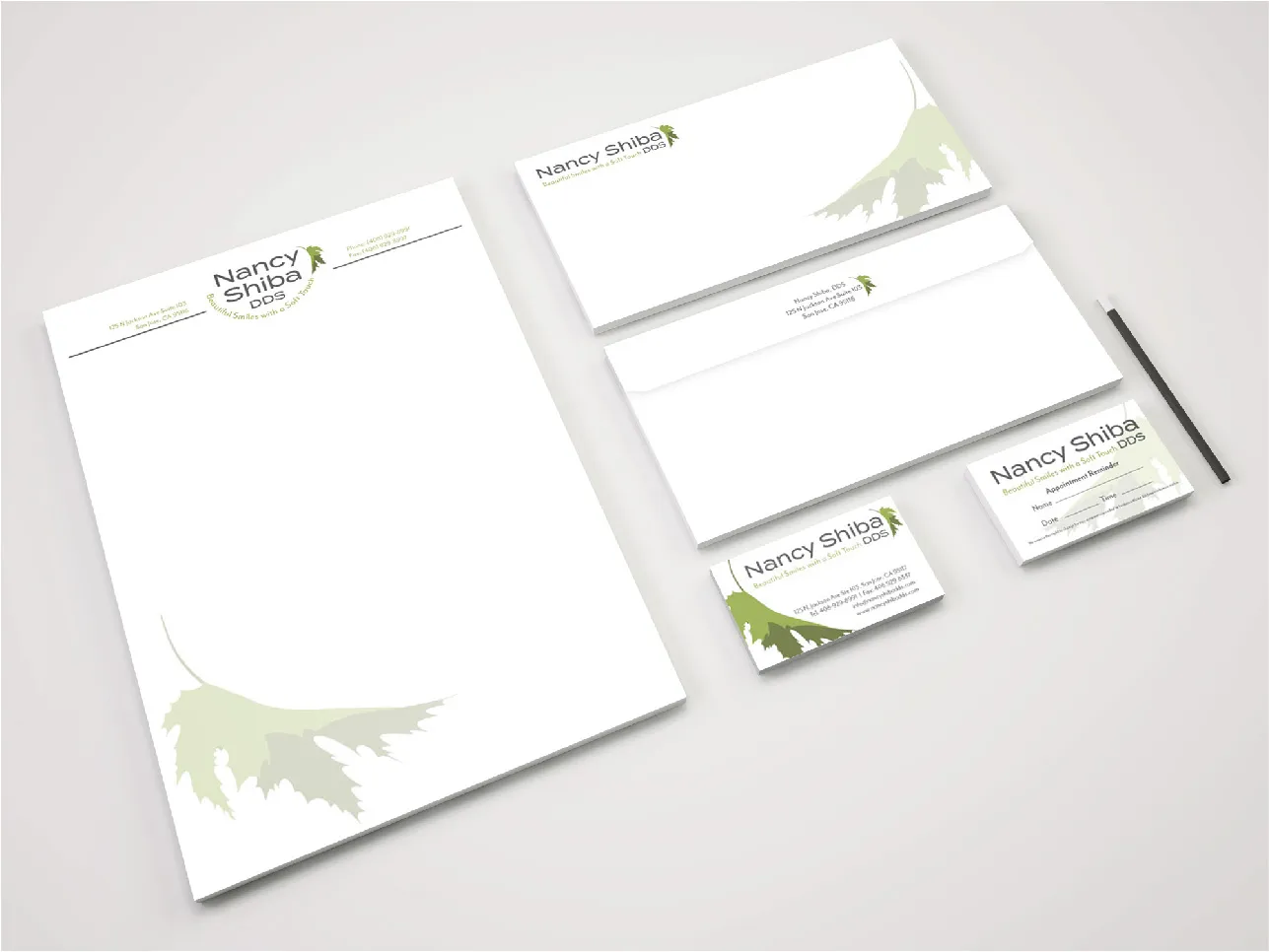 WEO Media Logo green and white letterhead and business card designs