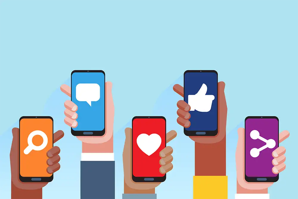 Multi skin color hands raising smartphones with social media application icons Multi skin color hands raising smartphones with social media application icons