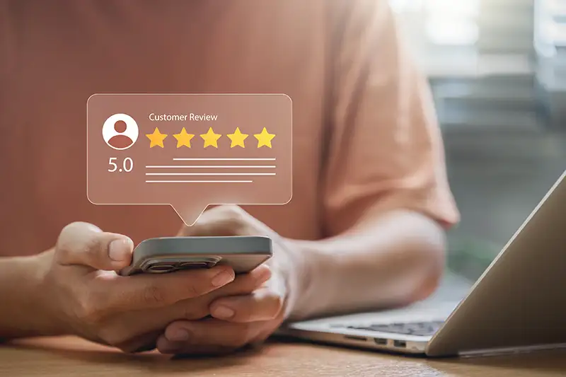 Person viewing customer review on smartphone Person viewing customer review on smartphone